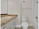 Well-lit bathroom featuring a vanity with countertop, toilet, and shower/tub combination at 12155 Pepperdine Pl, Orlando, FL 32826