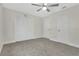Spacious bedroom featuring a ceiling fan and a large closet for ample storage at 12155 Pepperdine Pl, Orlando, FL 32826