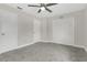 Clean bedroom featuring soft carpet, ceiling fan, and closet with plenty of storage space at 12155 Pepperdine Pl, Orlando, FL 32826