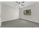 Light filled bedroom with gray carpet and a ceiling fan at 12155 Pepperdine Pl, Orlando, FL 32826