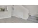Bright living room featuring wood flooring and access to the upper level at 12155 Pepperdine Pl, Orlando, FL 32826