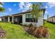 Charming backyard with a screened in patio and privacy landscaping at 1309 Lombardi Ct, Kissimmee, FL 34759