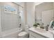 Clean and functional bathroom with a tub, shower, and well-lit vanity area at 1309 Lombardi Ct, Kissimmee, FL 34759