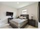 Comfortable bedroom showcasing a TV setup, neutral tones, and a relaxing atmosphere at 1309 Lombardi Ct, Kissimmee, FL 34759