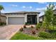 Charming single-story home with a screened porch, paver driveway, and well-maintained landscaping at 1309 Lombardi Ct, Kissimmee, FL 34759