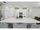 Bright kitchen with a spacious island, white cabinets, and stainless steel appliances at 1309 Lombardi Ct, Kissimmee, FL 34759