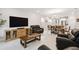 Spacious living room that boasts neutral tones and blends into an open-concept kitchen at 1309 Lombardi Ct, Kissimmee, FL 34759