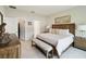 Elegant main bedroom boasts wood furnishings, tile floors, and a neutral color palette at 1309 Lombardi Ct, Kissimmee, FL 34759
