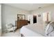 Comfortable main bedroom featuring a dresser, chair, and access to a walk-in closet at 1309 Lombardi Ct, Kissimmee, FL 34759