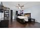 This bedroom provides a restful retreat with a ceiling fan, desk, and a comfortable sleeping area at 13129 Cog Hill Way, Orlando, FL 32828