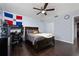 This bedroom is equipped with a ceiling fan, providing optimal airflow and a great space to unwind at 13129 Cog Hill Way, Orlando, FL 32828