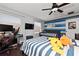 Comfortable bedroom features a ceiling fan, dual beds, and a vibrant design, perfect for children at 13129 Cog Hill Way, Orlando, FL 32828