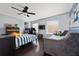 Comfortable bedroom equipped with a ceiling fan, dual beds, and ample space for relaxation and entertainment at 13129 Cog Hill Way, Orlando, FL 32828