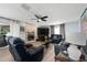 Comfortable living room with a cozy fireplace, modern furniture, and ample seating at 13129 Cog Hill Way, Orlando, FL 32828