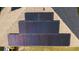 A close aerial view of multiple solar panels on a roof in a residential setting at 1383 Buckeye Trace Blvd, Winter Haven, FL 33881