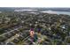 Residential neighborhood aerial view of single-Gathering homes featuring community amenities and serene lake views at 1383 Buckeye Trace Blvd, Winter Haven, FL 33881