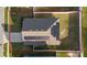 Aerial view of a house featuring solar panels on the roof and a fenced backyard at 1383 Buckeye Trace Blvd, Winter Haven, FL 33881