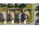 Aerial shot shows a house with a brown roof with solar panels and a fenced backyard at 1383 Buckeye Trace Blvd, Winter Haven, FL 33881