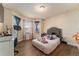 Cozy bedroom with hardwood floors, ample natural light, and comfortable furnishings at 1383 Buckeye Trace Blvd, Winter Haven, FL 33881