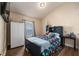 Stylish bedroom featuring a comfy bed, TV, and neutral-colored walls at 1383 Buckeye Trace Blvd, Winter Haven, FL 33881