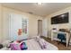 Comfortable bedroom with natural light, modern hard wood flooring, and spacious closet at 1383 Buckeye Trace Blvd, Winter Haven, FL 33881