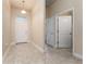 Welcoming entryway with tiled flooring, a front door with window, and access to various rooms at 1383 Buckeye Trace Blvd, Winter Haven, FL 33881