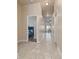 Inviting hallway with tiled floors, neutral paint, and views of bedrooms and living areas at 1383 Buckeye Trace Blvd, Winter Haven, FL 33881