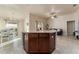 Spacious kitchen featuring an island with granite countertops and wood cabinets at 1383 Buckeye Trace Blvd, Winter Haven, FL 33881