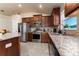 Modern kitchen with stainless steel appliances, granite countertops, and wood cabinetry at 1383 Buckeye Trace Blvd, Winter Haven, FL 33881