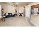 Open-concept space with living, dining, and kitchen areas featuring tile floors and neutral paint at 1383 Buckeye Trace Blvd, Winter Haven, FL 33881