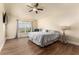 Spacious main bedroom boasts a ceiling fan, and a large window for natural light at 1383 Buckeye Trace Blvd, Winter Haven, FL 33881