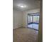 Bedroom with tile flooring and slider door leading to screened patio at 141 Varner Sw Dr, Winter Haven, FL 33880