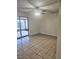 Bedroom with tile flooring, natural paint, and slider door leading to patio at 141 Varner Sw Dr, Winter Haven, FL 33880