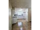 Bright kitchen with white cabinets, granite countertops and stainless steel appliances at 141 Varner Sw Dr, Winter Haven, FL 33880