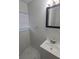 Bright bathroom with a white vanity, framed mirror, and modern fixtures at 1415 Zenith Pl, Orlando, FL 32808