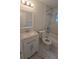 Updated bathroom with tub/shower, white vanity and marble backsplash at 1415 Zenith Pl, Orlando, FL 32808
