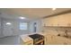 Bright kitchen with stainless steel appliances, white cabinets and stone countertops at 1415 Zenith Pl, Orlando, FL 32808