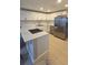 Contemporary kitchen with white cabinetry, stainless appliances, and ample counter space at 1415 Zenith Pl, Orlando, FL 32808
