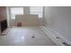 Living room with fireplace, tile flooring, and bright windows at 1415 Zenith Pl, Orlando, FL 32808