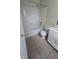 This bathroom features a tub, toilet, tiled floor and a single sink vanity at 15 Clear Way, Ocala, FL 34472