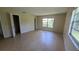 Bedroom featuring tile floors and a bright window at 15 Clear Way, Ocala, FL 34472