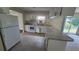 Functional kitchen with white appliances, ample counter space, and tile flooring at 15 Clear Way, Ocala, FL 34472