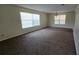 Large living room with carpet flooring, bright light, and ample space at 15 Clear Way, Ocala, FL 34472
