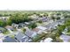 Aerial view showcases a tranquil residential area with lush greenery and orderly street layout at 1506 Brookebridge Dr, Orlando, FL 32825