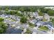 An aerial view of a quiet neighborhood with tree-lined streets and well-maintained homes at 1506 Brookebridge Dr, Orlando, FL 32825