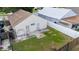 Aerial image of a backyard with a combination of grass, concrete patio, and fencing at 1506 Brookebridge Dr, Orlando, FL 32825