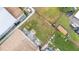 Aerial shot of a backyard featuring grass, a fence, and a small patio area between homes at 1506 Brookebridge Dr, Orlando, FL 32825