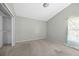 A bright bedroom with neutral walls and standard closet space offers a calm, blank canvas at 1506 Brookebridge Dr, Orlando, FL 32825