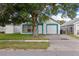 Charming single-story home with a well-maintained lawn, and a one car garage at 1506 Brookebridge Dr, Orlando, FL 32825