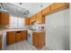 Functional kitchen with wooden cabinets and laminate countertops at 1506 Brookebridge Dr, Orlando, FL 32825